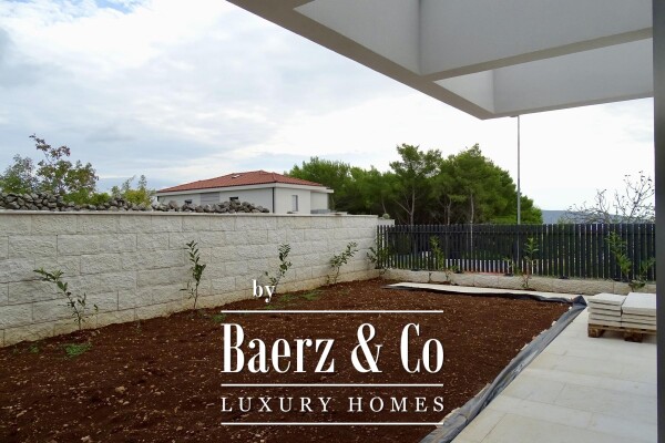 photo 2 Krk, a three-bedroom apartment with a living area 120m2, garden, and basement